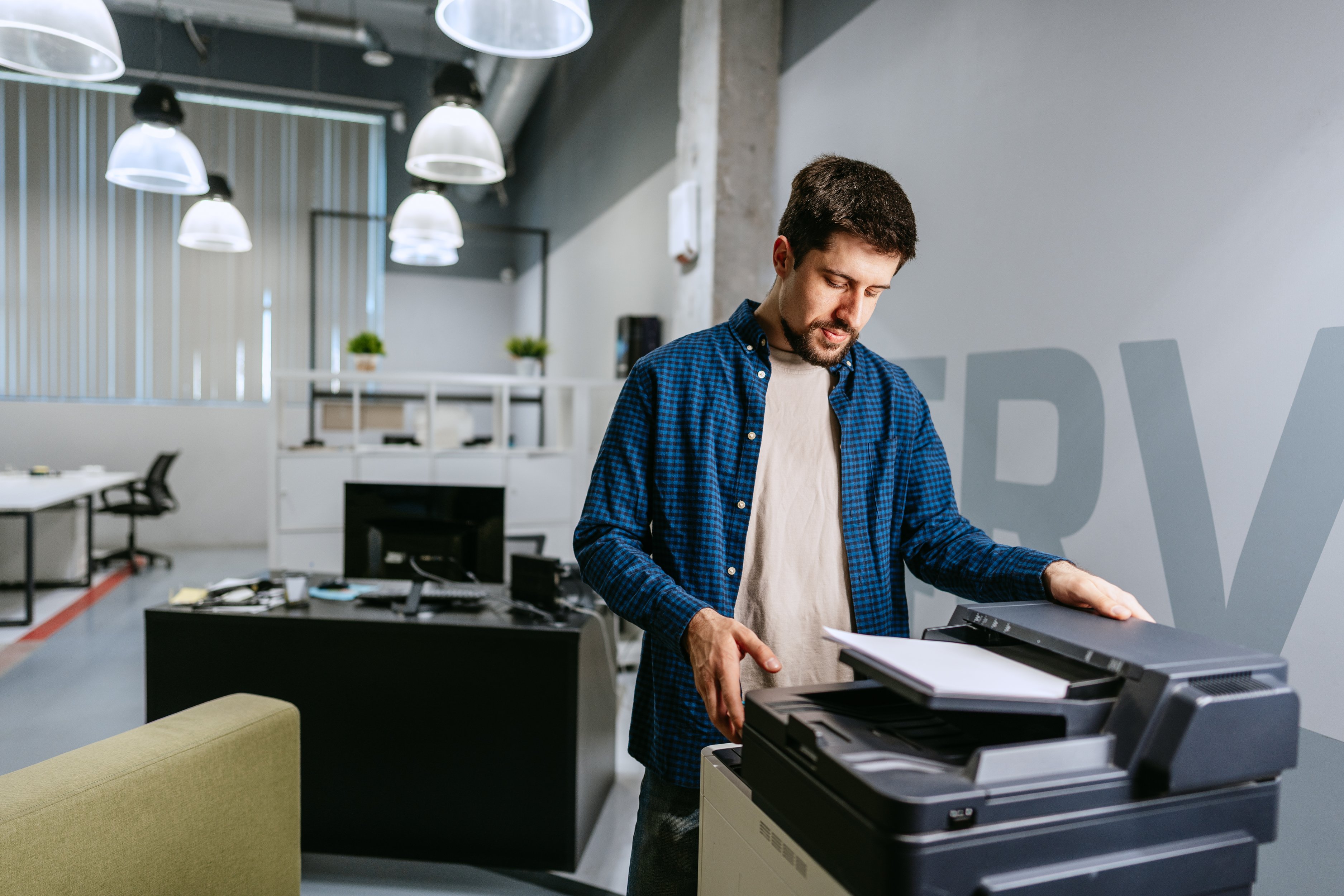 man-operating-printer-modern-office-environment-working-hours man-operating-printer-modern-office-environment-working-hours